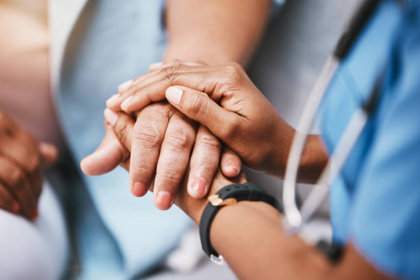 istockphoto-1473155464-612x612 Empathy, trust and nurse holding hands with patient for help, support and support and healthcare advice. Kindness, counseling and medical therapy in nursing home for hope, consultation and psychology