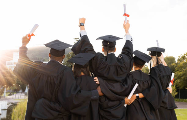 istockphoto-1480277406-612x612 Graduation, group and back view of students celebrate education success. Behind of excited graduates at campus celebration for study goals, university award and learning motivation for happy future